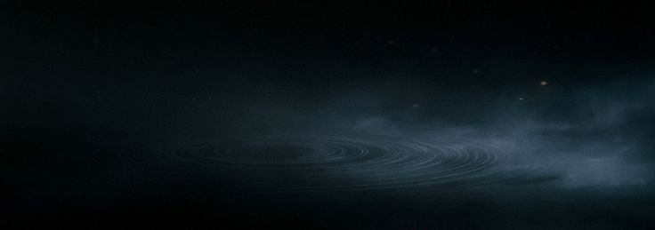 Abstract circular sound waves moving through a dark, fog-filled room